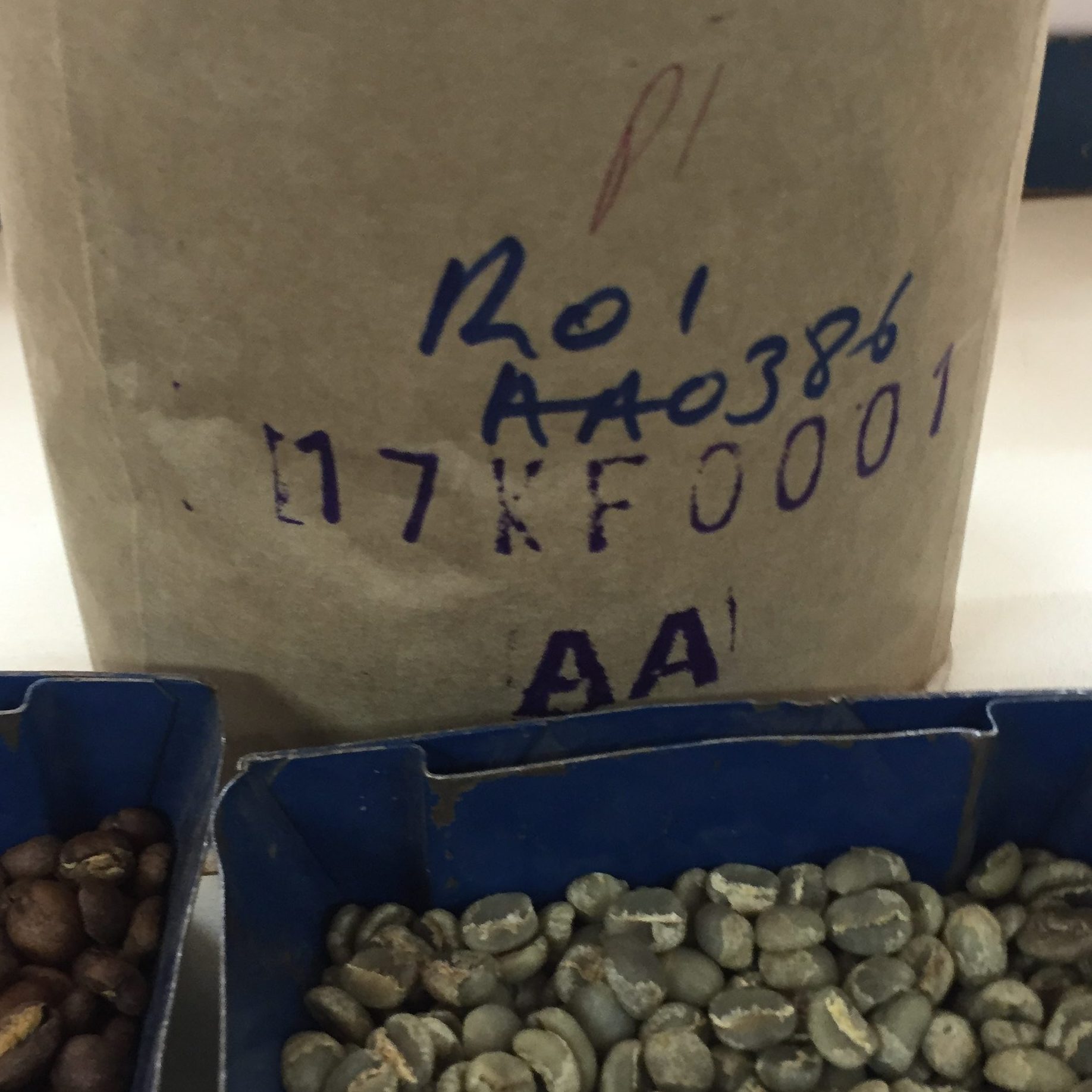 A sample of a coffee at an export cupping in Kenya. The outturn number—17KF0001—is stamped on the bag